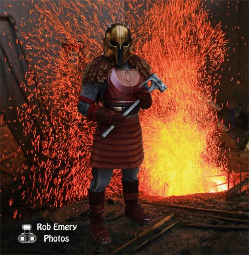 The Armourer next to her forge